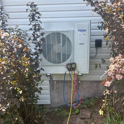 Heat pumps on an exterior wall
